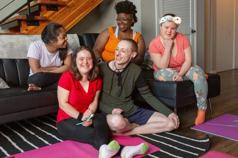 Disabled group of friends happily smiling and talking